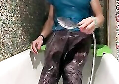 Wetlook in baths. Juicy leggings and polo t-shirt in shower.