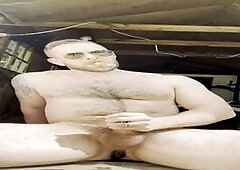 Rodrick Snow enjoys a cigar while exploring his backdoor with a speculum