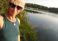 Swimming in the lake in fitness wear at sunset.. Moist stretch pants and t-tee-shirt...