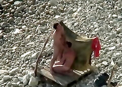 guys sucking on the beach