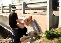 Busty teen gives a blowjob and gets nailed in the outdoors