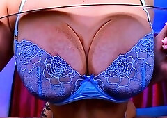 Busty cougar in bra and panties poses playfully on webcam