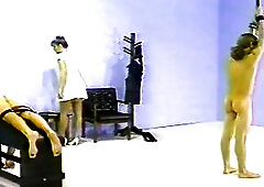 A slavemaster Lady playing wit 2 resigned males vintage Female domination