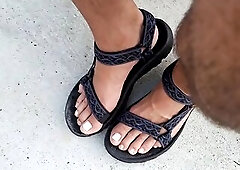 My hunk pedicured feet in sandals