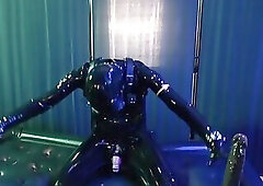 Rubberboy with gas mask pisses and cums