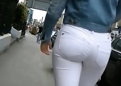 Street voyeur chases a hot amateur babe in tight white pants