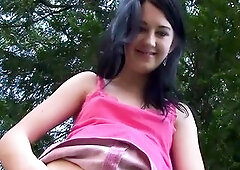 Cute teen Lolly flashing her small tits and pussy outdoors